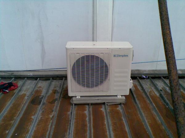 Air conditioner on rusted roof