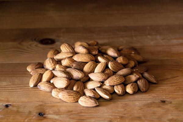 Almonds nuts on rustic wood