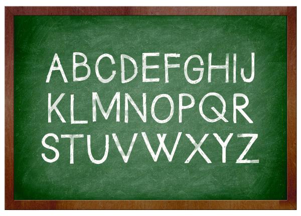 Alphabet chalk on school chalkboard