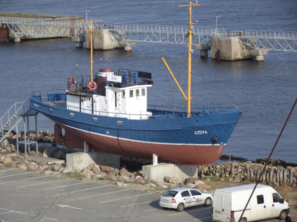 An old fishing boat on stand