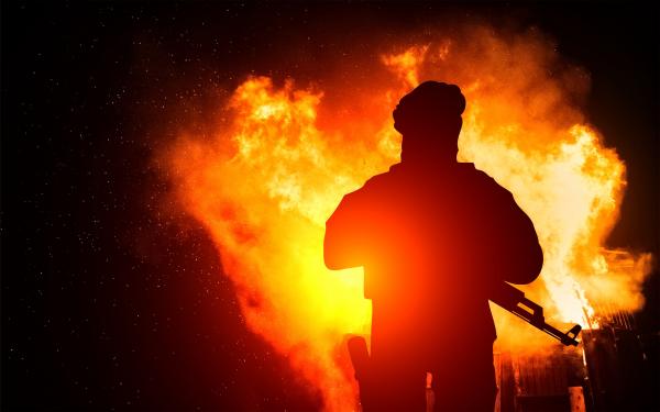 Armed Man with Background Explosion