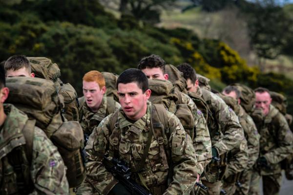 Armies in Camouflage Uniform Lining Up Closeup Photo