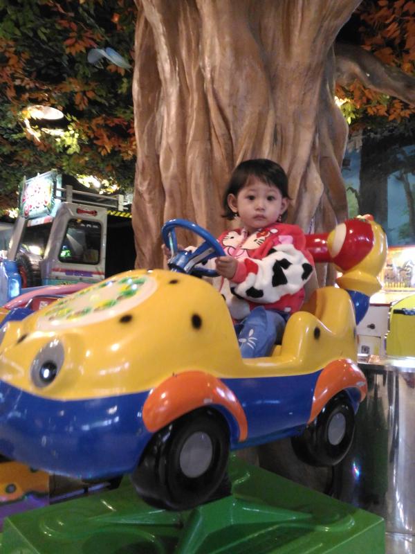 Baby Girl in Merry Round