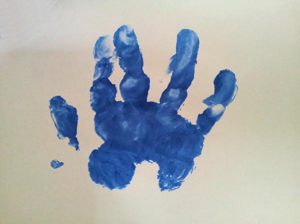 Baby hand inprint over white surface
