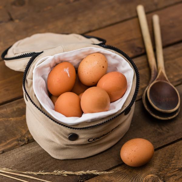 Beige Egg Inside a White Bag