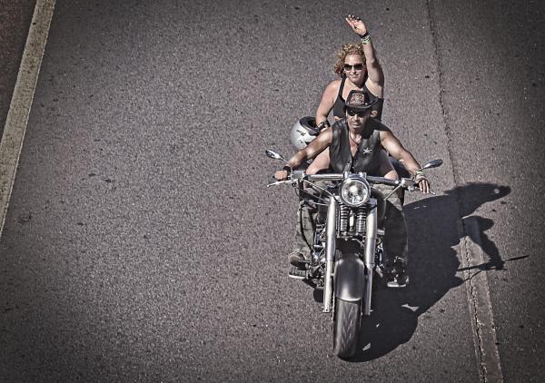 Biker waving on a chopper bike
