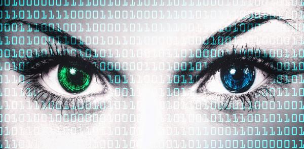 Binary computer code on human face - Online privacy concept