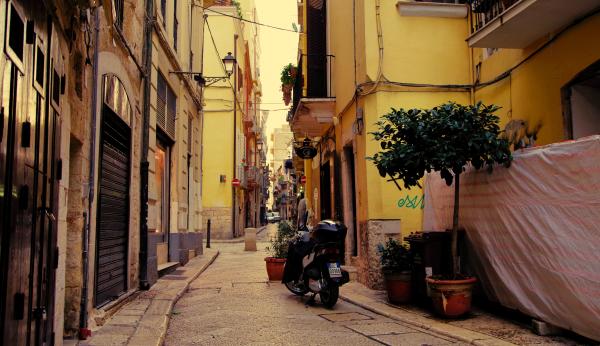 Black Naked Motorcycle Surrounding by Houses
