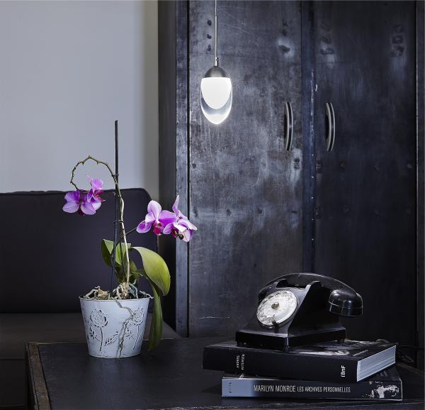 Black Rotary Telephone on Black Book Cover