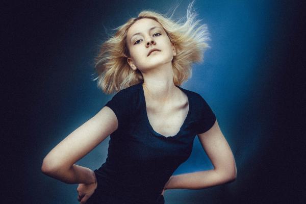 Blonde Haired Woman Wearing Black Scoop Neck Shirt