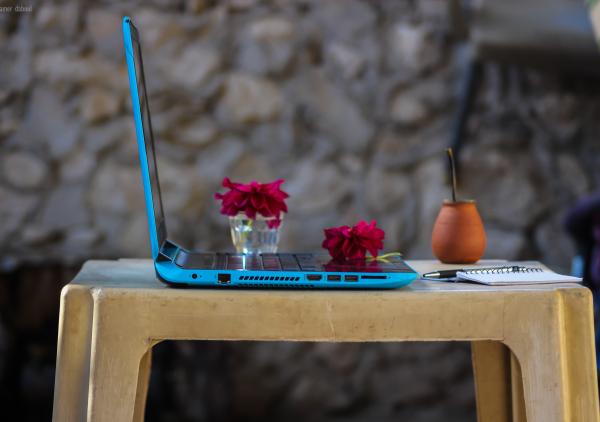 Blue Laptop Computer On Brown Plastic Table