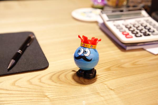 Blue Round Plastic Toy on a desk