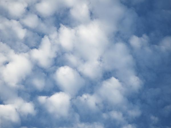 Blue Sky and Fluffy White Clouds