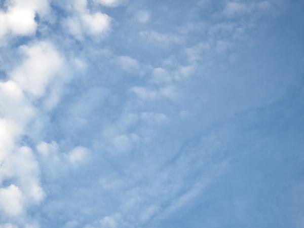 Blue Sky and Fluffy White Clouds
