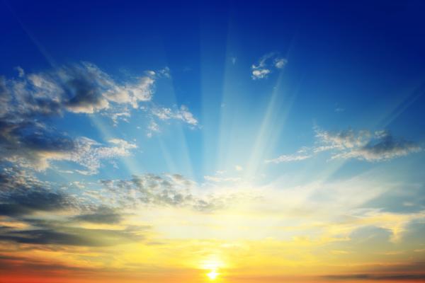 Blue sky with clouds and sun