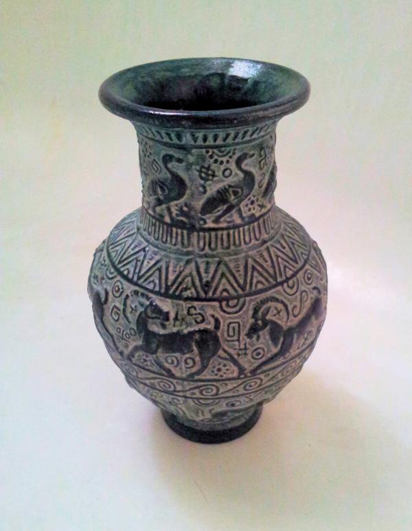 Blue vase over white background