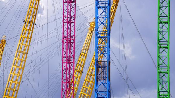 Blue Yellow Red and Green Metal Bar With Metal Sprint in Low Angle Photography