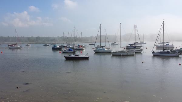 Boats in the mist on the hamble river