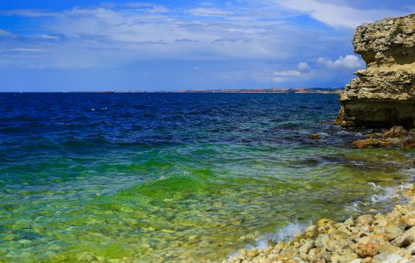 Body of Water Under Cloudy Sky during Daytime