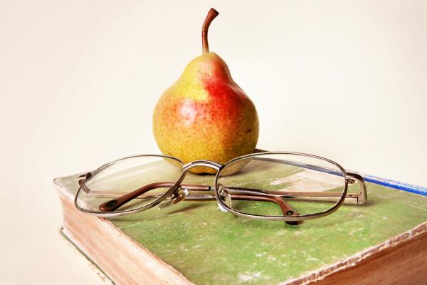 book, glasses and pear