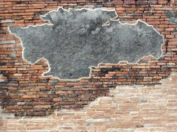 Brick Wall with Blank Concrete Patch