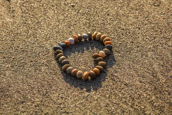 Brown and Grey Stone Formed Heart on Sand