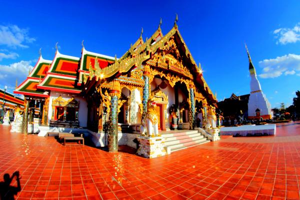 Brown and White Traditional House Under Blue Sky
