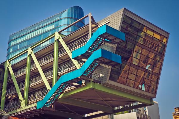 Brown Blue and Green Building With Blue Staircase