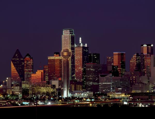 Brown Building With Lights on During Night Time