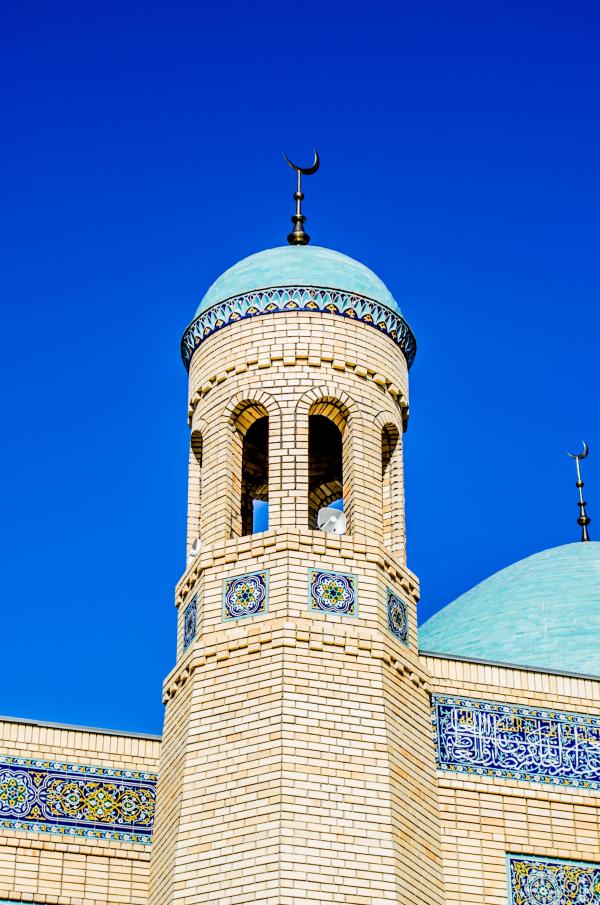 Brown Concrete Mosque Under Blue Sky during Daytime