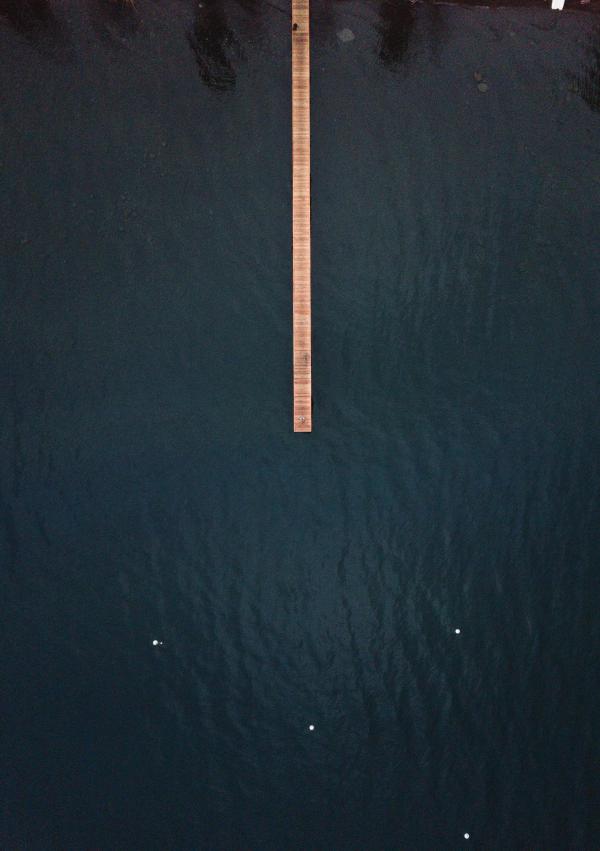 Brown Wooden Dock on Top of Body of Water