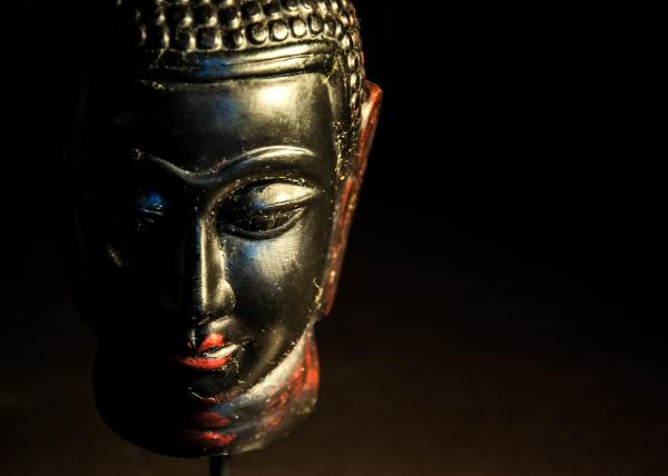 Buddha statue dark background