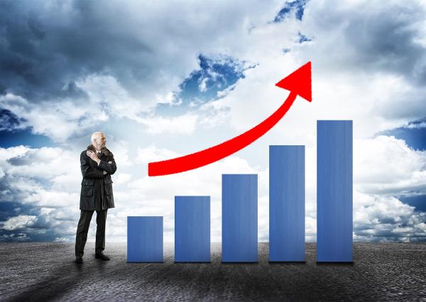 Businessman and Bar Chart with Arrow - Money Growth Concept