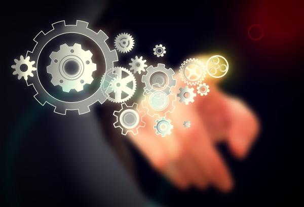 Businessman and Cogwheels on Virtual Screen - Work Concept