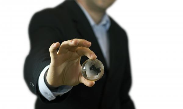 Businessman and crystal globe