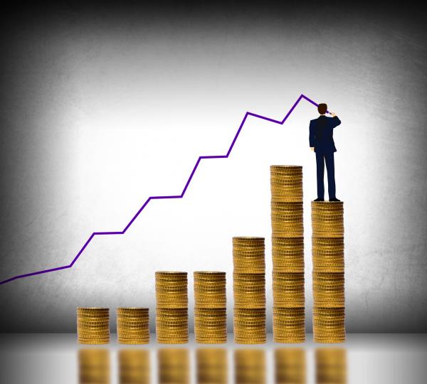 Businessman drawing a finance graph