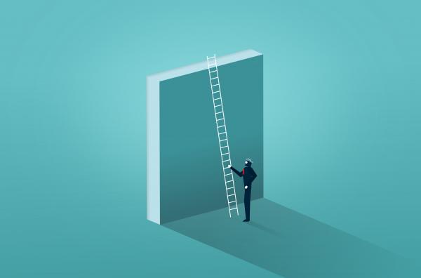 Businessman Facing a Wall - Overcoming Barriers