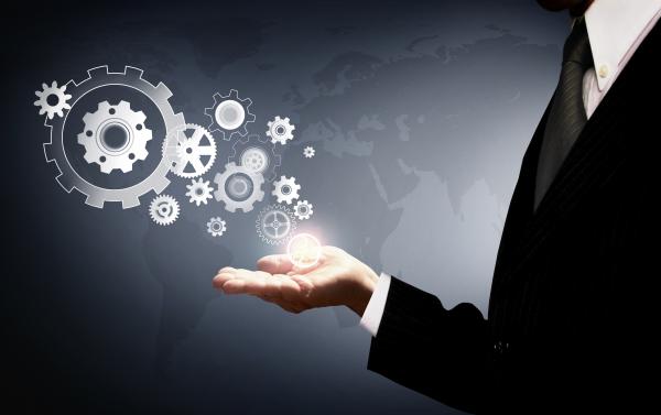 Businessman Holding Virtual Cogwheels - Business and Work