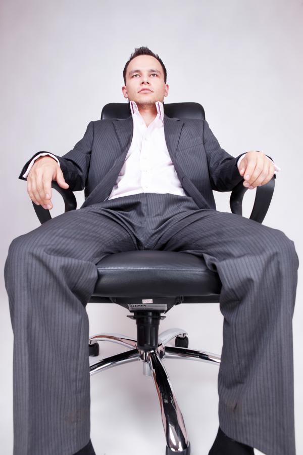 Businessman Sitting in Chair