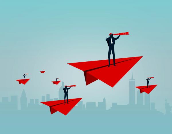 Businessmen riding paper airplanes
