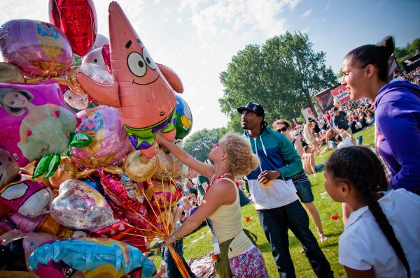 Buying balloons at festival