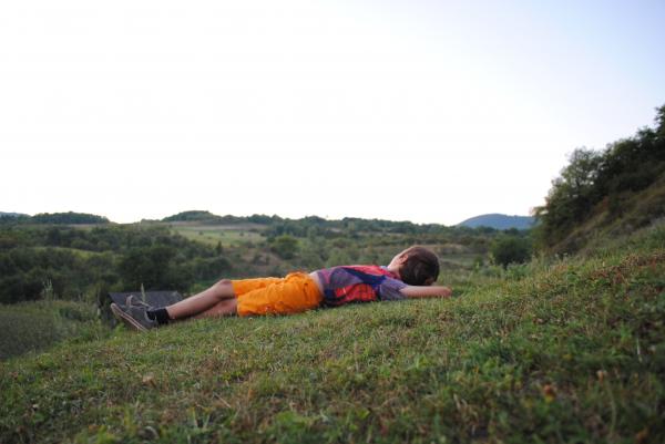 Careless kid watching the sunset