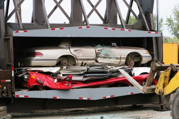 Cars Being Crushed At The Junkyard