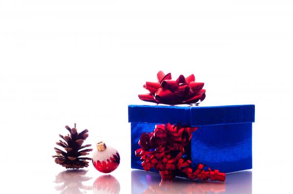 Christmas ornaments and gift box on white