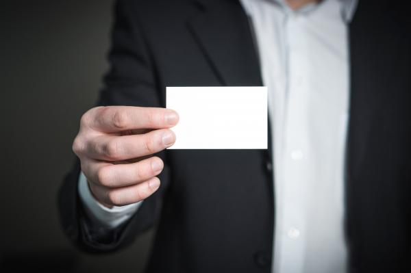 Close-up of a Person Hand With Card