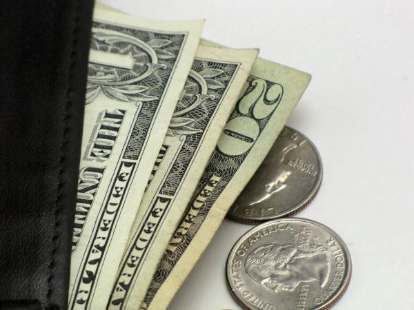 Close-up of dollars and quarters