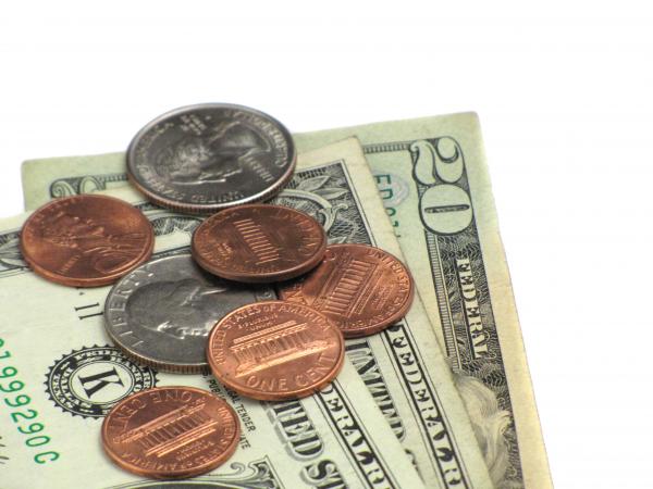 Close-up of some dollars and coins