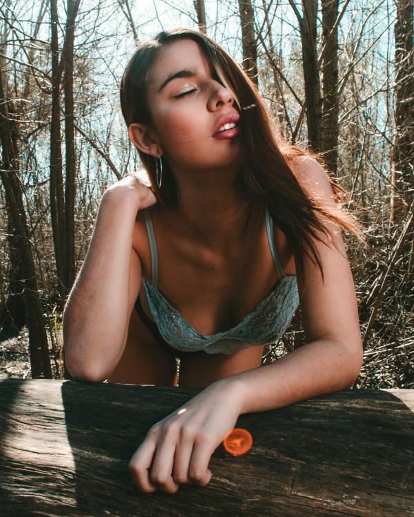 Close Up Photo of Woman in Teal Lace Brassiere