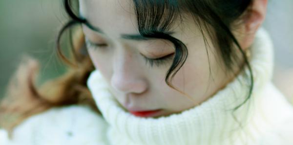 Close Up Photo of Woman in White Turtle Neck Top