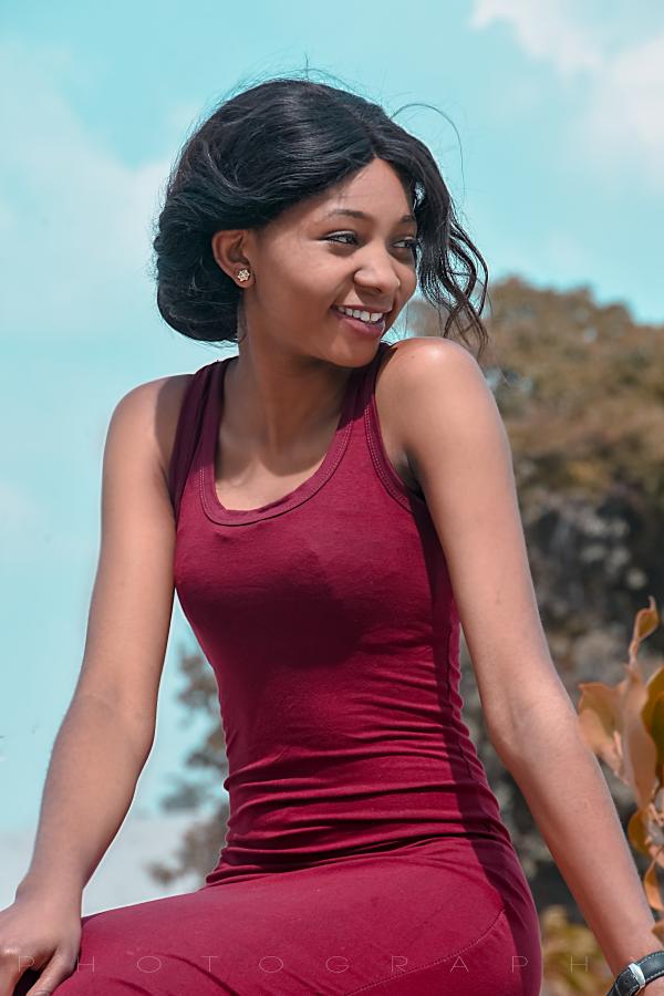 Close Up Photograph of Woman Wearing Red Tank Top